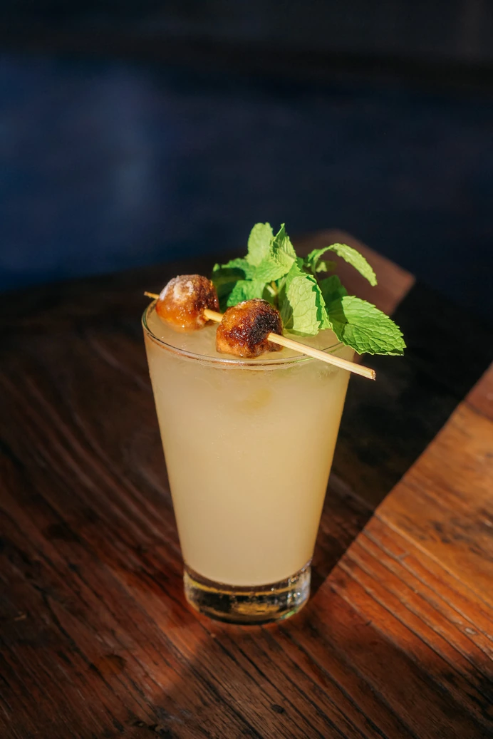 An arak punch cocktail at twilight at Seed in Bingin