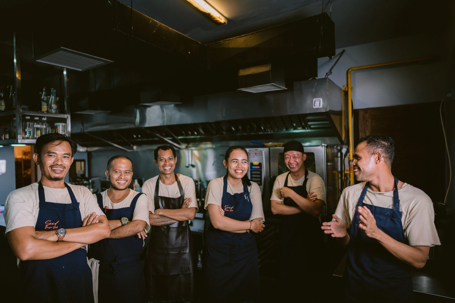 The Seed kitchen team lined up together in the kitchen in Bingin, Uluwatu